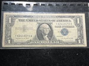 lot 84 image: 1957A US BLUE SEAL $1 SILVER CERTIFICATE STAR NOTE