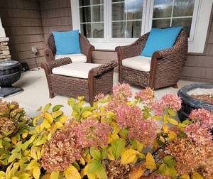 lot 24 image: Brown Barrel Wicker Chairs and Ottoman Set, as