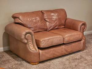lot 21 image: Distressed Leather Tan Loveseat