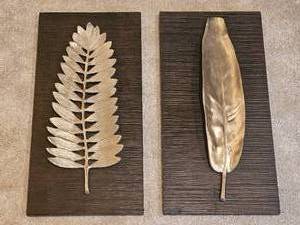 lot 99A image: Uttermost Metallic Spelter Wall Hangings  Feather & Olive Branch
