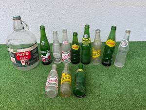 lot 82 image: Coca-Cola Syrup Bottle & Soda Bottles