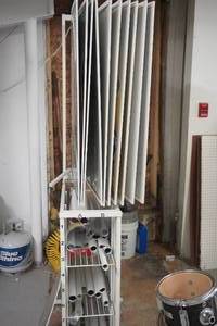 lot 26 image: Retail Poster Display Stand With Assorted Music Themed Posters