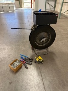 lot 50 image: Black Strapping Cart, strapping tools, gloves and seals for strapping