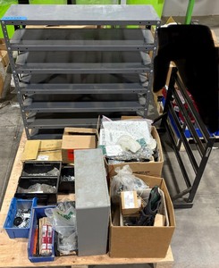 lot 125 image: Pallet of Hardware, parts cabinet, a 6-shelf open metal storage unit, a black heavy-duty rail bin rack.