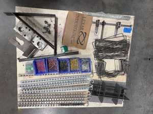 lot 158 image: Industrial rail with heavy-duty clips, corner brackets, screws, hex couplers, and more