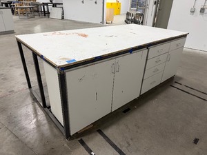 lot 226 image: 4x8 steel base wlaminated top bottom has 1 side open, 1 side retrofitted wdrawers & 2-door cabinet