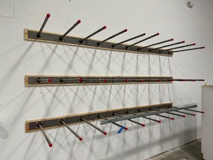 lot 228 image: (3) 10 long wall mounted straight bar pegs