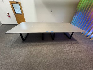 lot 244A image: Conference table with four U-shaped metal leg supports.