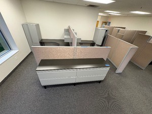 lot 268 image: 1 workspace with 2 cubicles. Cubicles include L-shaped desk, 2 hanging shelves, gear locker, floor protector