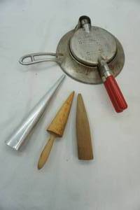 lot 556 image: Vintage Krumkake Iron and Accessories