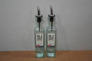 lot 102 image: 2 Glass Oil & Vinegar Bottles