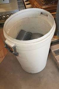 lot 189 image: Rubbermaid Plastic Barrel with Corrugated Tubing
