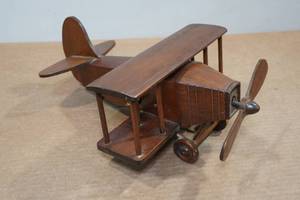 lot 235 image: Wood Wind-Up Plane