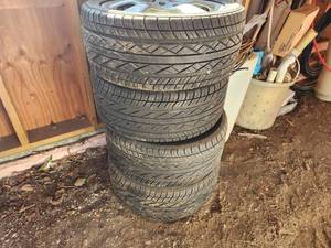 lot 951 image: Lot of (4) Yokohama P23545R17 97H Tires with 1000 Miglia 5-Lug 17 Rims