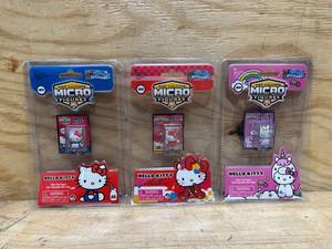 lot 22 image: Worlds Smallest Micro Figures Hello Kitty - (lot of 3)