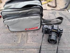lot 73 image: Canon T50 Camera & Bag