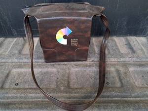 lot 83 image: Kodak Instant Camera Caddy Case & Canon AE1 Camera With Flash