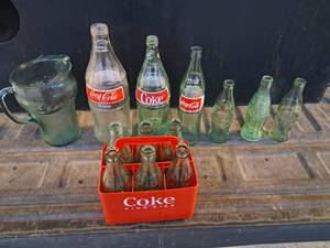 lot 92 image: Coca Cola Bottles, Six Pack Carrier, and Pitcher