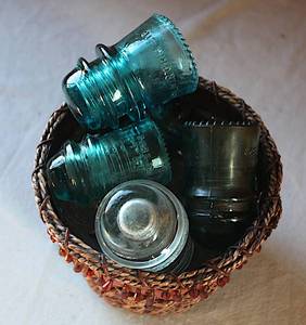 lot 0148 image: Antique Glass Insulators - Bundle with Basket