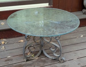 lot 175 image: BY - Round Glass Top Table with Ornate Metal Base, 30in Diameter
