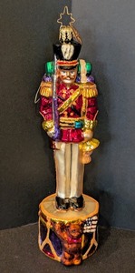 lot 271 image: DR - Christopher Radko 7 Inch Nutcracker Glass Ornament with Drum Base