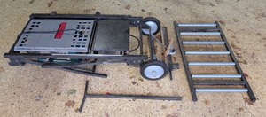 lot 309 image: G - Makita 2708 Table Saw with Wheeled Stand and Roller Conveyor