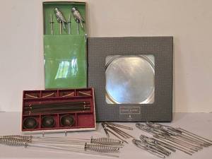 lot 246K image: K - Mixed Entertaining Set Grand Buffet Chargers, Parrot Skewers, Nutcrackers and Serving Forks