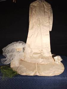 lot 25 image: Vintage wedding dress with train, vale, cake topper and hair accessory