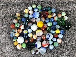 lot 202 image: Lot of Collectible Marbles - Some illuminate green when hit with a black light - see pictures