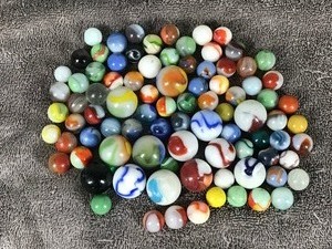 lot 203 image: Lot of Collectible Marbles - Some of them Illuminate green when hit with a black light - see pictures