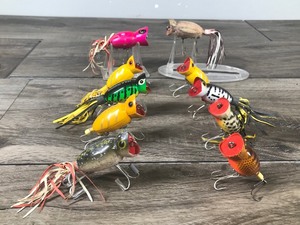 lot 217 image: Lot of 10 Collectible Fred Arbogast Hula Popper Fishing Lures