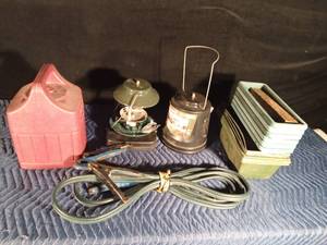 lot 43 image: 2 Coleman lanterns with cases, planter, and jumper cables