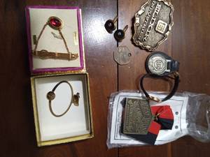 lot 69 image: Tie clasps, cuff links, belt buckle, medallion,1982 IDS key ring, watch and more