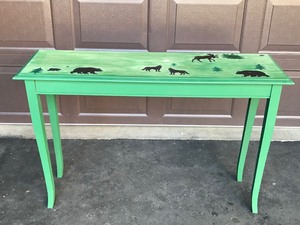 lot 7 image: Solid Wood Green Table with Moose, Wolfs and Bears Painted on the Table - Smoke Free
