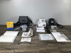 lot 320 image: Lot of 3 Cameras with Accessories