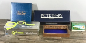 lot 324 image: Lot of Board Games - Minnesota Trivia Tour - Trivia Pursuit (Master Game - Genus Edition) - Pictionary - Trivial Pursuit (Time Capsule Edition) - Shut the Box Game
