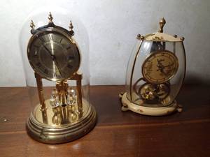 lot 86 image: Vintage 1954 Aug Schatz & Sohn German 400-day anniversary mantel Mademoiselle clock and another anniversary 400-day dome clocke