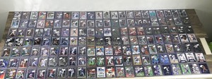 lot 417 image: Large Lot of Baseball, Football, Basketball and Hockey Cards - All of them are in top loader sleeves