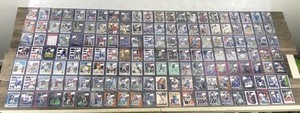 lot 418 image: Large Lot of Baseball, Football and  Basketball. All of them are in top loader sleeves