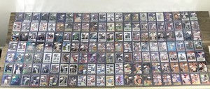 lot 420 image: Large Lot of Baseball, Football and  Basketball. All of them are in top loader sleeves