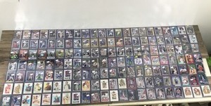 lot 421 image: Large Lot of Baseball, Football and  Basketball. All of them are in top loader sleeves