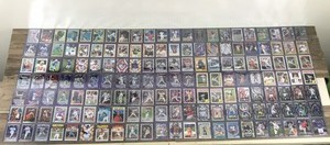 lot 423 image: Lot of Baseball, Football, Basketball, Hockey and More. All the cards are in top loader sleeves