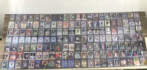 lot 424 image: Lot of Baseball, Football, Basketball, Hockey and More. All the cards are in top loader sleeves