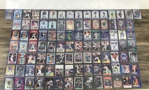 lot 425 image: Lot of Baseball, Football, Basketball and Hockey. All the cards are in top loader sleeves