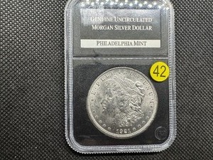 lot 42 image: 1921 Genuine Uncirculated Morgan Silver Dollar in PCS Holder
