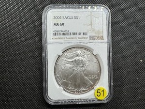lot 51 image: 2004 1 Oz. Silver American Eagle NGC MS69 - NGC Price Guide is $65