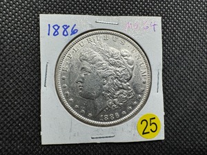 lot 25 image: 1886 Morgan Silver Dollar Marked MS64 When Purchased