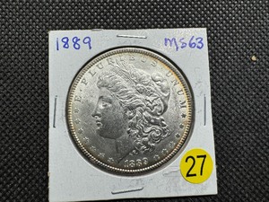 lot 27 image: 1889 Morgan Silver Dollar Marked MS63 When Purchased