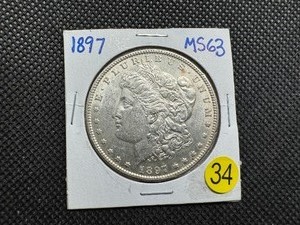 lot 34 image: 1897 Morgan Silver Dollar Marked MS63 When Purchased