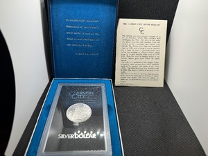 lot 6 image: GSA Uncirculated 1882 Carson City Morgan Dollar with Original Box and Certiicate